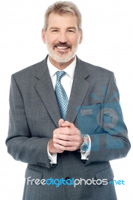 Businessman Posing With Clasped Hands Stock Photo