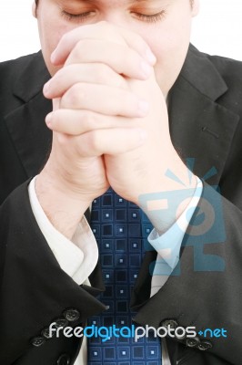 Businessman Praying For Success Stock Photo