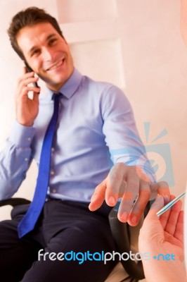 Businessman Receiving Manicure Treatment Stock Photo