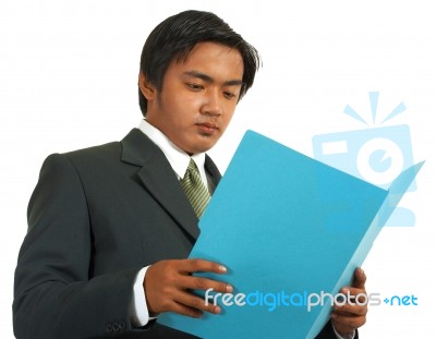 Businessman Reviewing Folder Stock Photo