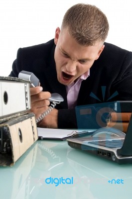 Businessman Shouting On Phone Stock Photo