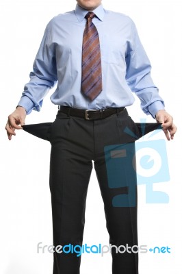 Businessman Showing Empty Pockets Stock Photo