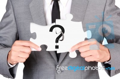 Businessman Showing Jigsaw Connect Create Question Mark Stock Photo