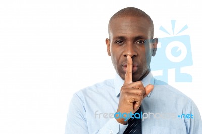 Businessman Shows Silence Gesture Stock Photo