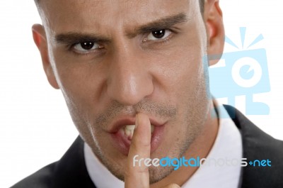 Businessman Shushing With Close Up Pose Stock Photo