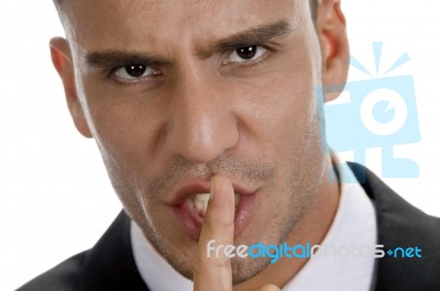 Businessman Shushing With Close Up Pose Stock Photo Businessman Shushing With Close Up Pose Stock Photo