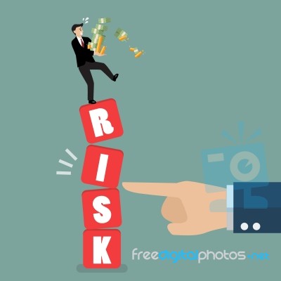 Businessman Standing On Shaky Risk Blocks By Hand Of Enemy Stock Image