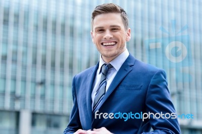 Businessman Standing Outside Modern Building Stock Photo