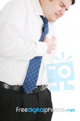 Businessman Suffering Heart Attack Stock Photo