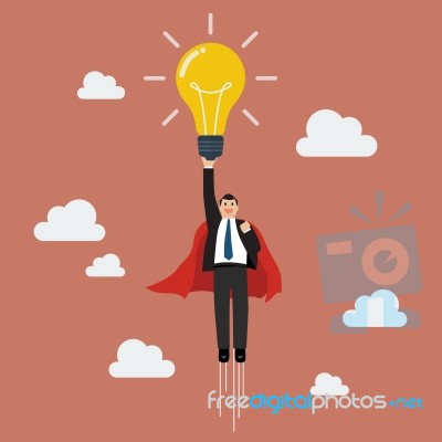 Businessman Superhero Holding Creative Lightbulb Stock Image