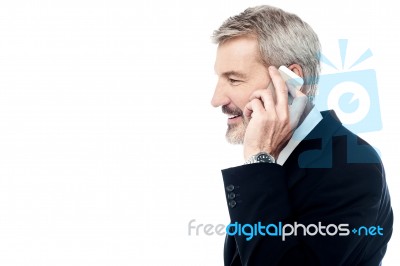 Businessman Talking On Phone Over White Stock Photo