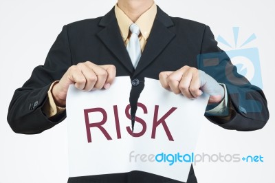 Businessman Tearing Sheet Paper, Risk Management Concept Stock Photo