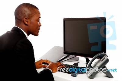 Businessman Typing On Computer Stock Photo