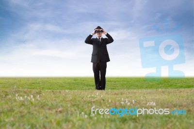 Businessman Using Binoculars Stock Photo