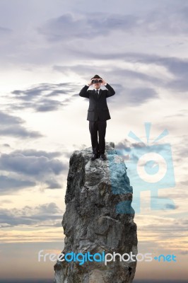 Businessman Using Binoculars Stock Photo