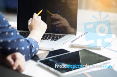 Businessman Using Laptop Computer At The Office Stock Photo