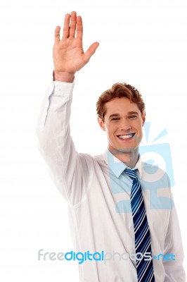 Businessman Waving Hi To His Colleague Stock Photo