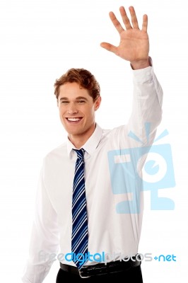 Businessman Waving Hi To His Colleague Stock Photo