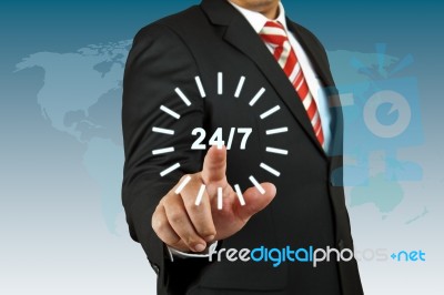 Businessman With 24 Hour Circle Stock Photo