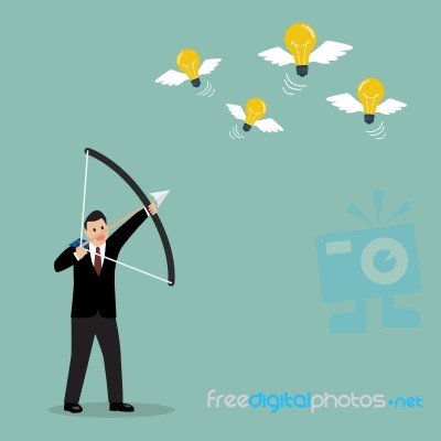 Businessman With A Bow And Arrow Hitting The Light Bulb Fly Stock Image