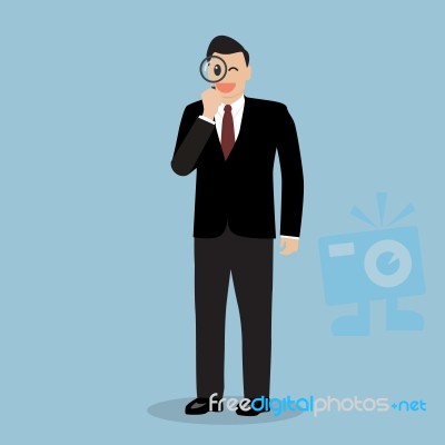 Businessman With A Magnifying Glass Stock Image