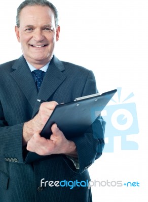 Businessman With Clipboard Stock Photo