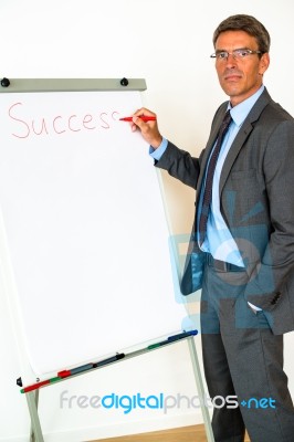 Businessman With Flipchart Stock Photo