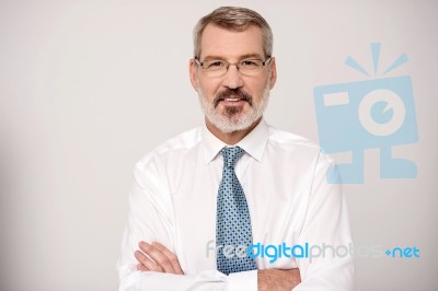Businessman With Folded Arms Stock Photo