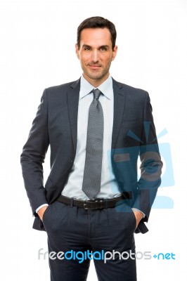 Businessman With Hand In Pockets Stock Photo