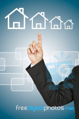 Businessman with house Stock Photo