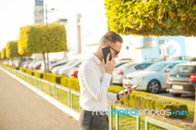 Businessman With Mobile Phone And Tablet In Hands Stock Photo Businessman With Mobile Phone And Tablet In Hands Stock Photo