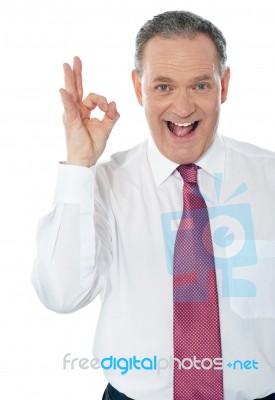 Businessman With Okay Hand Sign Stock Photo