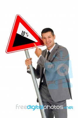 Businessman With Road Sign Stock Photo