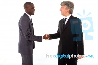 Businessmen Shaking Hands Stock Photo