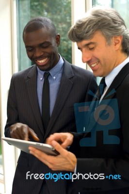 Businessmen With Tablet Stock Photo