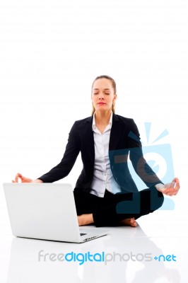 Businesswoman Doing Yoga Stock Photo