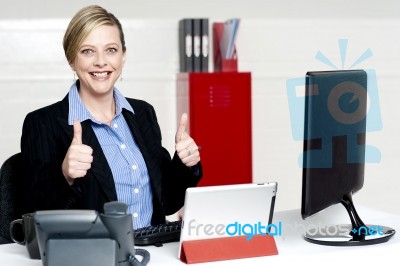 Businesswoman Gesturing Thumbs Up Stock Photo