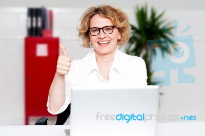 Businesswoman Gesturing Thumbs Up Stock Photo