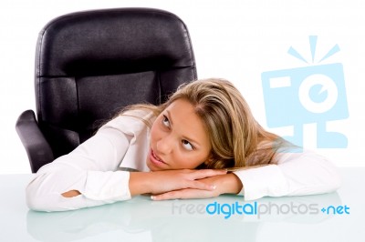 Businesswoman Lying On Desk Stock Photo