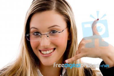 Businesswoman Showing Telephonic Gesture Stock Photo