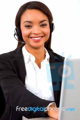 Businesswoman With Headset And Pc Stock Photo