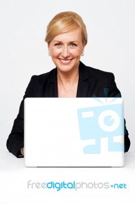 Businesswoman Working On Laptop Stock Photo