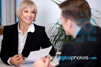 Businesswoman Working With Her Colleagues Stock Photo