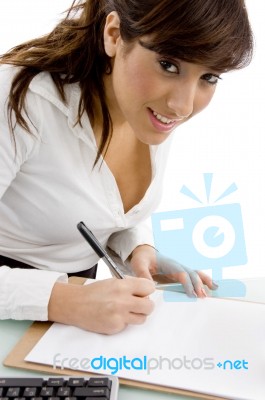 Businesswoman writing on Papers Stock Photo