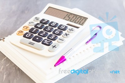 Calculator, Pen And Notepad For Notes Stock Photo