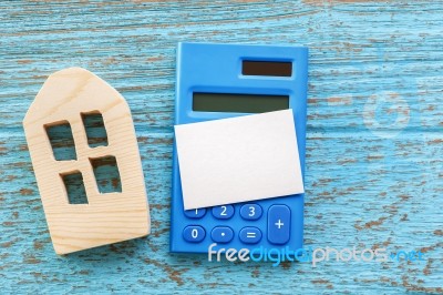 Calculator With House Model And Blank Card Stock Photo
