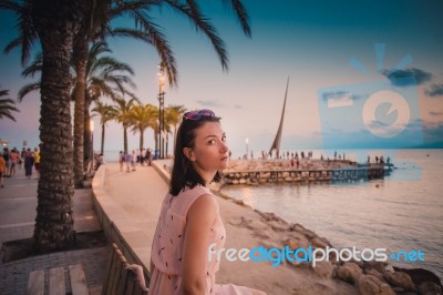 Calm Tourist Girl On Pier Stock Photo