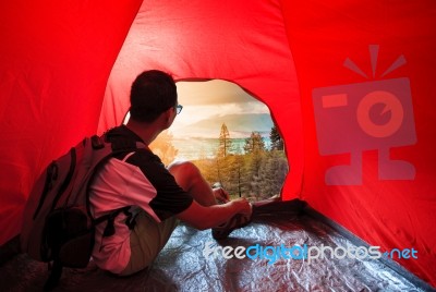 Camping Man In Camper Tent Looking To Beautiful Natural Scenic Use For People Vacation Traveling To Destination Stock Photo
