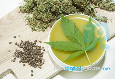 Cannabis Home Made Healing Ointment And Marijuana Green Leaf And Seeds Stock Photo