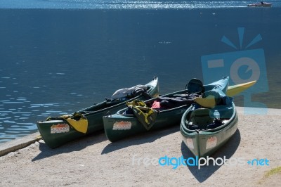 Canoes Beached On The Shore Of Hallstatt Lake Stock Photo
